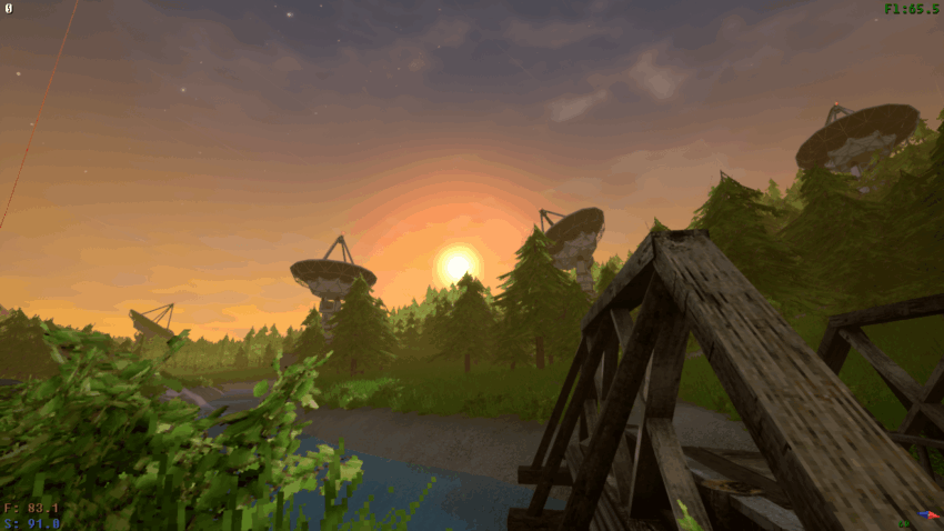 several radar domes on a tree-lined hill at sunset
